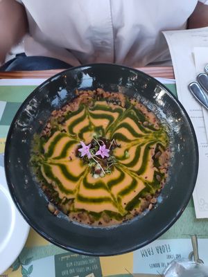 Farm gazpacho with toasted seed crumble, chive blossoms was yummy at Flora Farms in San Jose Del Cabo