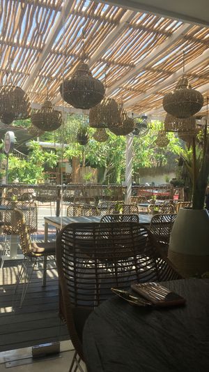 Outdoor and indoor seating  at The Place With No Name in Pecatu