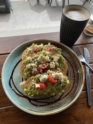 Smashed Avocado with Almond Feta and Cherry Tomatoes  at Love Madre in Cheltenham