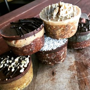 Healthy Cass Creations: golden gaytime, tim tam, raw carrot cake, coconut rough and mint chocolate. at Love Madre in Cheltenham