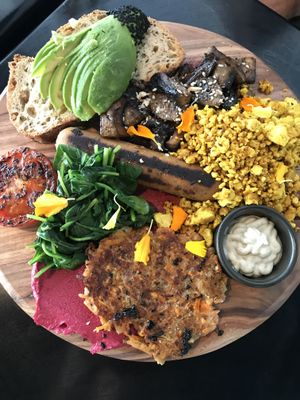 Big Madre Brekkie: scrambled tofu, Italian sausage, garlic mushrooms, rosti, grilled tomato, beetroot hummus, spinach, toast and cashew garlic cream. at Love Madre in Cheltenham