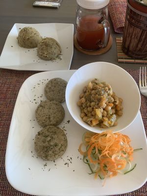 Coconut chickpeas, sweet potato mash, Callaloo dumplings, watermelon juice  at Living Food and Juices in Kingston