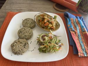 Yucca (callaloo dumplings), veggie rundown, salad with the prices they charged here, this is a very expensive meal  🧐  at Living Food and Juices in Kingston