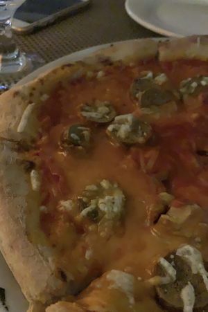 Vegan pizza with vegan cheese and sausage. at Amore Mio in Oranjestad