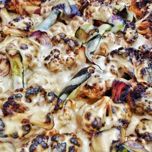 Sinia. Baked cauliflowers and veggies in zucchinisauce at Vivida in Tel Aviv