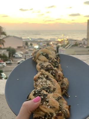 Delicious, flaky, and flavorful bread woven with spinach, mushroom, and cashew cheese... WOW at Vivida in Tel Aviv