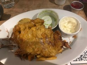 Half eaten Banana Blossom Fish and Chips. Comes with Mushy Peas at The Pullman in Folkestone