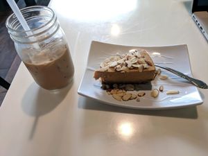 pumpkin almond cheesecake and iced coffee! at Golden Era Vegan Restaurant in San Francisco