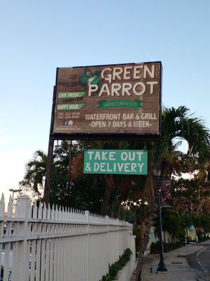 Sign outside the restaurant at The Green Parrot in Nassau