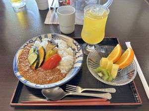 Vegan vegetable keens curry with passion fruit juice   at Suimui in Naha