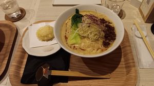 Soy milk dandan udon noodles, additional topping tempura soft boiled egg at Taiko Udon in Hiroshima