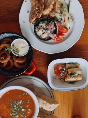 Goulash, Springrolls, Eggplant Dip and Onion Rings. at Szabad Bisztro in Budapest