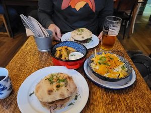 Front no cheese burger, dirty fries, onion rings and beet patty rear at Szabad Bisztro in Budapest