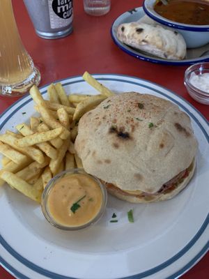 Notcheese burger and goulash in the background  at Szabad Bisztro in Budapest