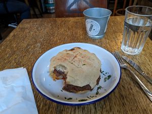 I promise that the Balkan Burger did not have a bite taken before it was served to me. at Szabad Bisztro in Budapest