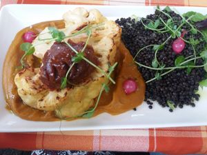 Cauliflower steak with sweet potato puree, beluga lentils and date pesto at Forgó Étterem in Dunabogdany