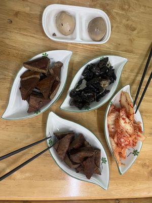 Spiced egg, tofu, mushrooms and kimchi  at Zhōu TàiTài 粥太太養生蔬食 in Xiaoliuqiu