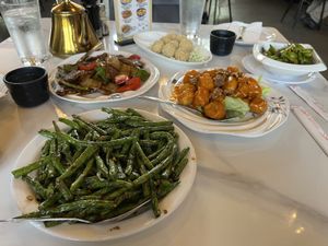 Green beans, sesame balls, honey walnut chicken (not sure if vegan), edamame, pepper steak  at Rui's Shanghai Bistro in Redlands