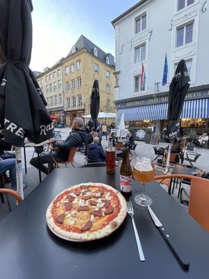 Added onion to the sausage pizza, local beer, nice buildings to look at.  at The Tube Bar in Luxembourg City