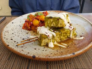 Mesquite Grilled Tofu Skewers with pomegranate tomato salad at Greens Restaurant in San Francisco