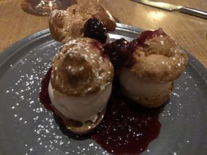 Roasted strawberry ice cream profiteroles and berry sauce at Greens Restaurant in San Francisco