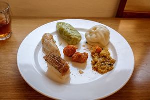 Buns, eel sushi, gyoza, spiced chicken at Loving Hut in Tokyo