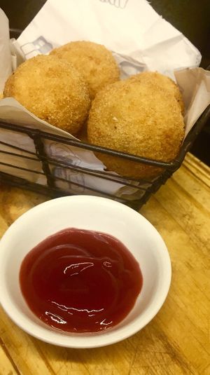 Croquetas: smash potatoes, olives and cheese at Liberty Bar in Montevideo