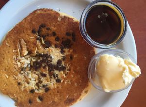 side of trail mix pancake: coconut, chocolate chips, walnuts at Herbivore - Mission District in San Francisco