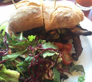 portobello mushroom sandwich with side salad  at Herbivore - Mission District in San Francisco