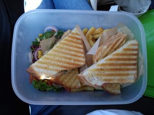A great meal of toasties, chips and salad at the UVC and put into our own containers for our long journey home! at Ultimate Vegan Cafe in Lichfield