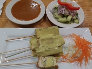 Satay tofu skewers (comes with peanut sauce and side of cucumbers and onions) at Coco Thai Cuisine in Orlando
