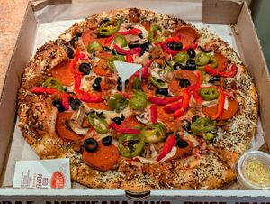 Medium 12" Vegan Red Sauce with Vegan Cheese Pizza with Black Olive, Jalapeño, Mushroom, Roasted Red Pepper, Vegan Pepperoni, and Vegan Sausage at Americana Pizza in Boise