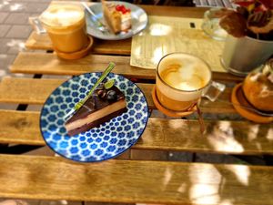 Tiramisu cake and a cappuccino at Plantmilkyway in Budapest