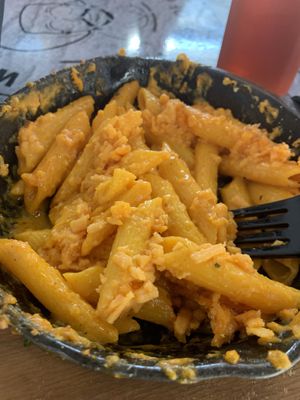 Vegan Mac and cheese with a few bites taken out at World Famous House of Mac in Miami