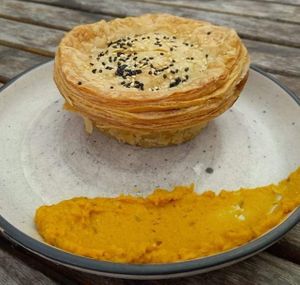 Vegan creamy mushroom pie with pumpkin hummus on the side. at Gratitude in Tauranga