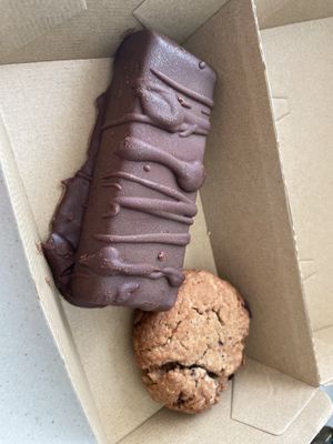 Take away snickers and PB protein cookie!🍪   at Gratitude in Tauranga