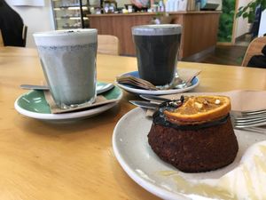 Blue Zen Latte and Charcoal Latte + vegan cake at Gratitude in Tauranga