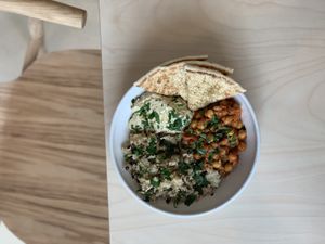 Rice bowl with matbucha chickpeas, lentils, hummus and pita  at Colours Bowls in Prahran