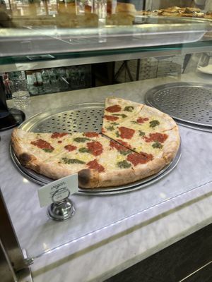Basil cashew pesto, vegan mozzarella, and crushed plum tomato  at Uncle Tony's Pizza in New York City