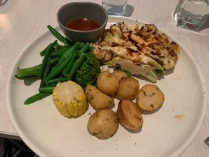 Cauliflower steak with char potatoes and veg. The potatoes were great the cauliflower a bit undercooked in my opinion   at Bistro Sixty5 in Adelaide