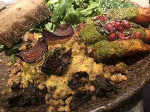 Veggie plate (with 2 choices of side dishes: mushrooms and lentils, spicy pumpkin) plus Falafel!  at Honest Greens - Plaça Catalunya in Barcelona