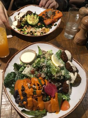 Kale caesar salad with falafel and poke with falafel at Honest Greens - Plaça Catalunya in Barcelona