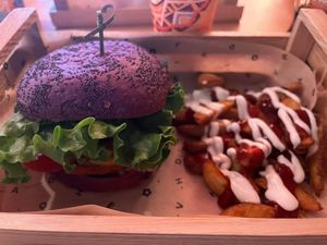 Cheesy Cecio with spicy sauce and wedges. Burger contains a chickpea patty and vegan cheddar cheese. at Flower Burger in Verona