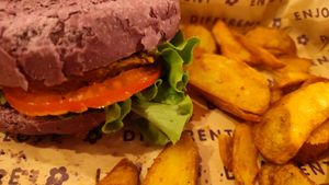 Hummus burger with potatoes. at Flower Burger in Verona