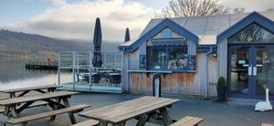Outside (with swan sitting at entrance :)) at The Bluebird Café by the Lake in Coniston