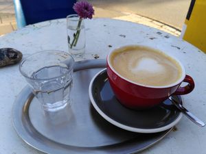 Cappuccino with Oatmilk - They always serve some water with the coffee! at Fräulein Coffea in Bochum