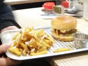 Royale burger (cheeze burger) with garlic fries and kimchi Cole slaw  at VGN Boulevard in Stourbridge