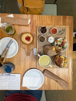 Fondue plate, tart and cheese bread  at Purana in Sao Paulo