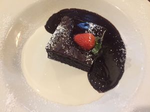 Vegan chocolate brownie with cream   at White Rock Inn in Underriver