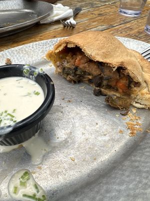 Freaking amazing! Great vibes, good vegan pasties! I have the vegan Guinness Stew pasty & it did not disappoint! Half is already eaten. I love how many vegan options they have.   at Cornish Pasty Co in Flagstaff